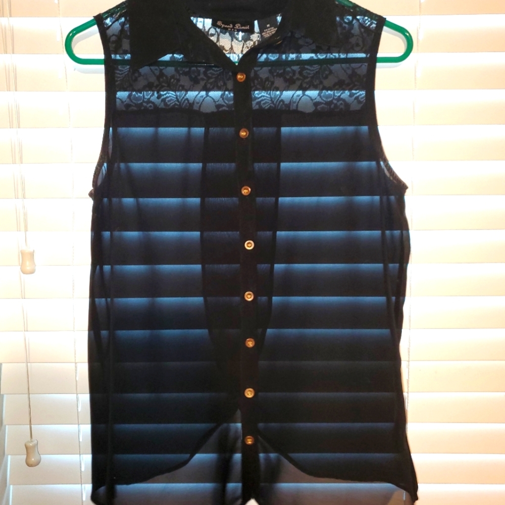 Is semi see through button-up black blouse